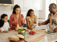 A happy family preparing meal together